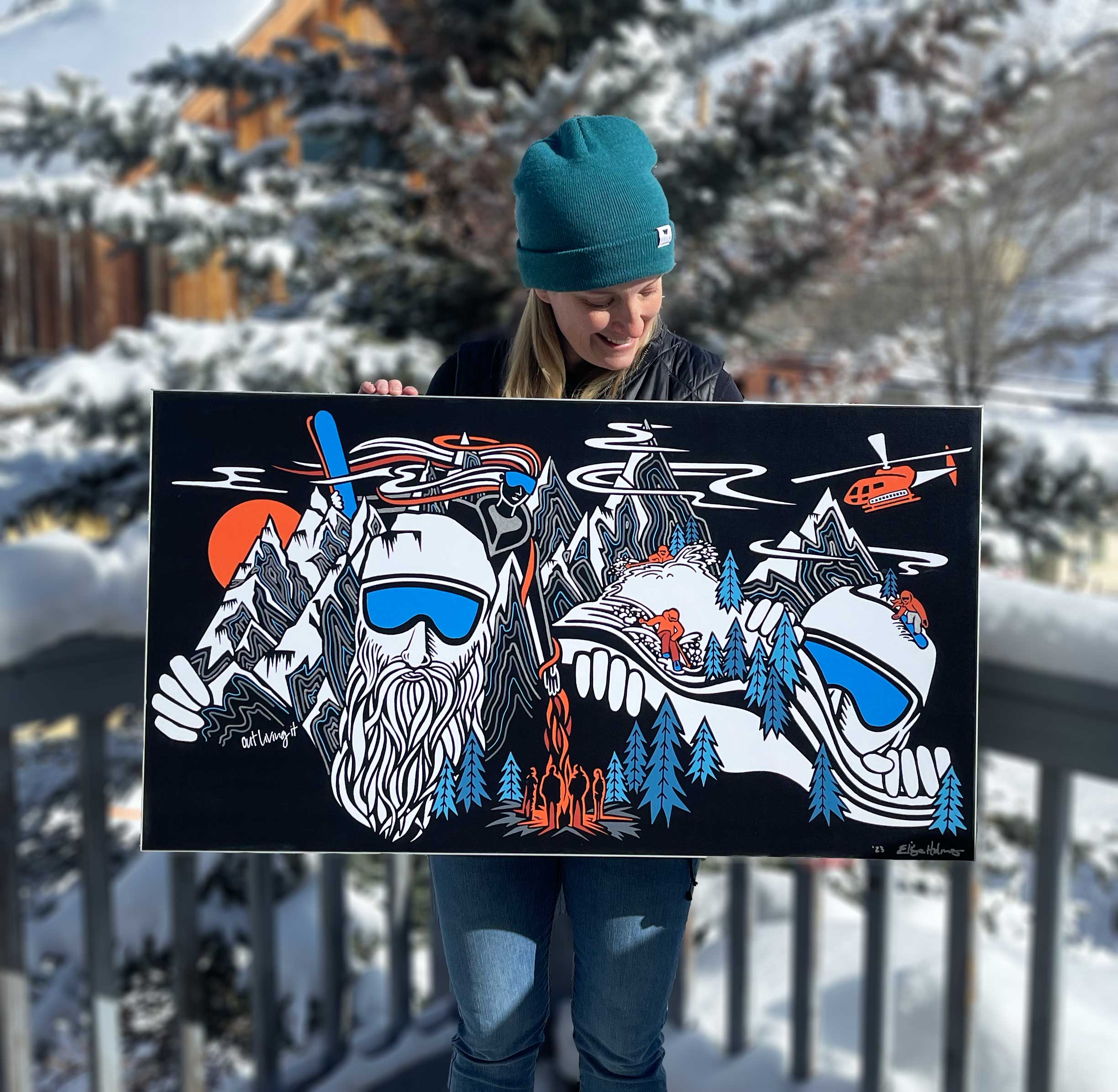 Elise Holmes Holding Artwork created for First Descents Silverton Shredfest